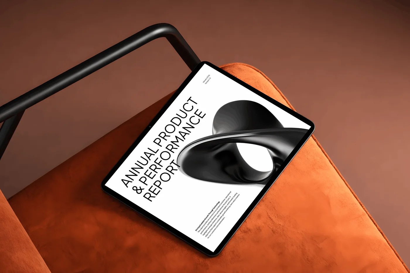 Printed annual report resting on an orange chair